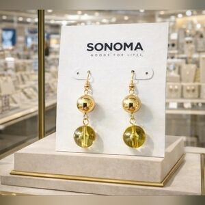 Women's dangly gold earrings